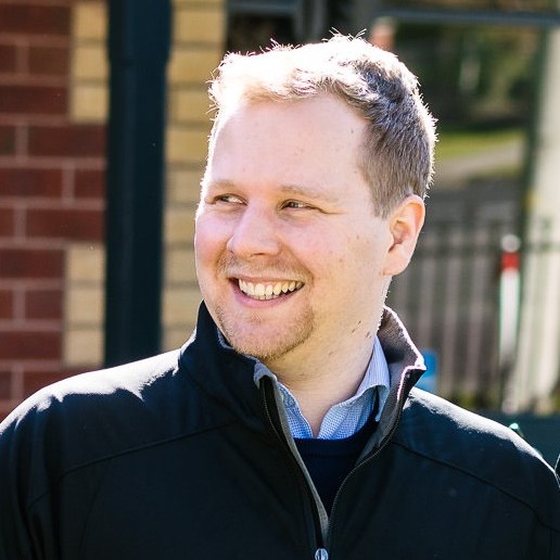 Brenton Johnson, casual portrait in an Uptake Digital jacket